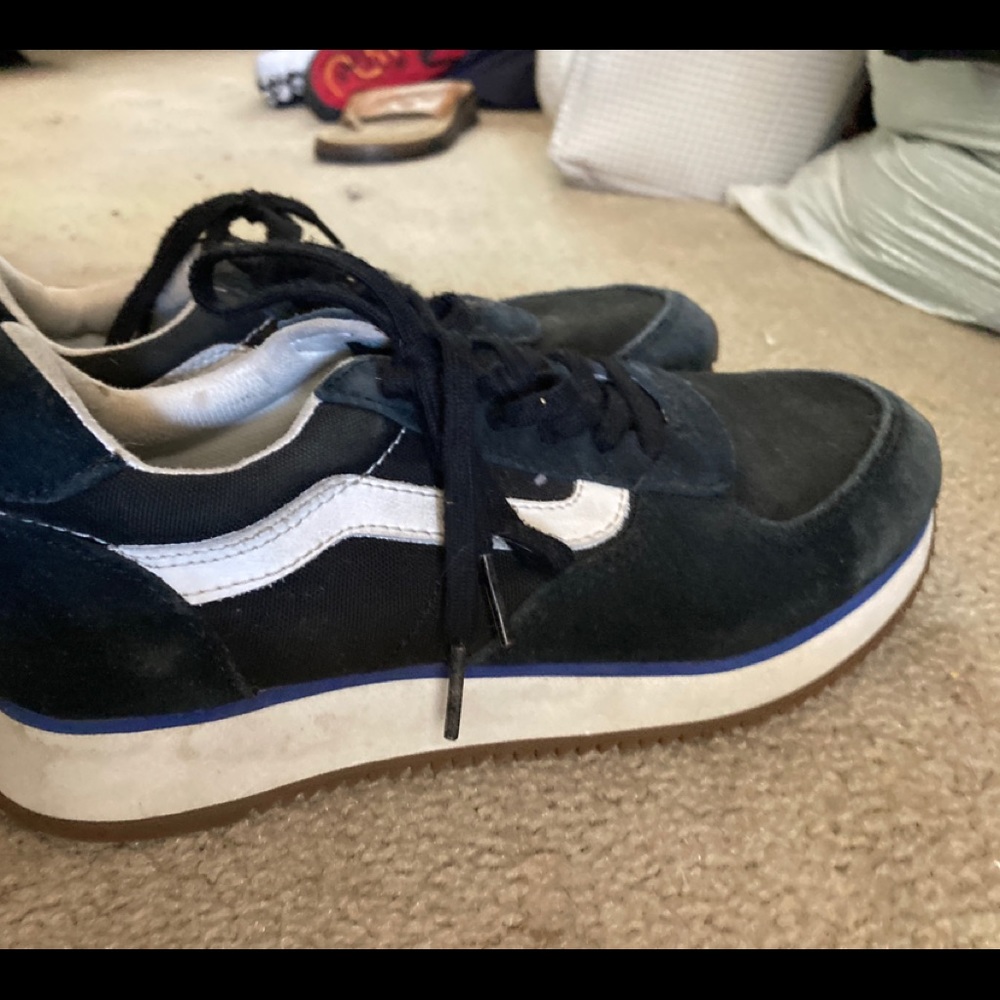 Black and white Vans running shoes